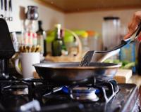 Cooking over a stovetop/Joshua Resnick/Shutterstock Cooking over a stovetop/Joshua Resnick/Shutterstock